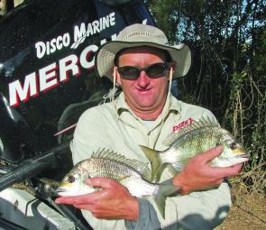 Scott Lane with a pair of the sort of bream the Clarence River is famous for.